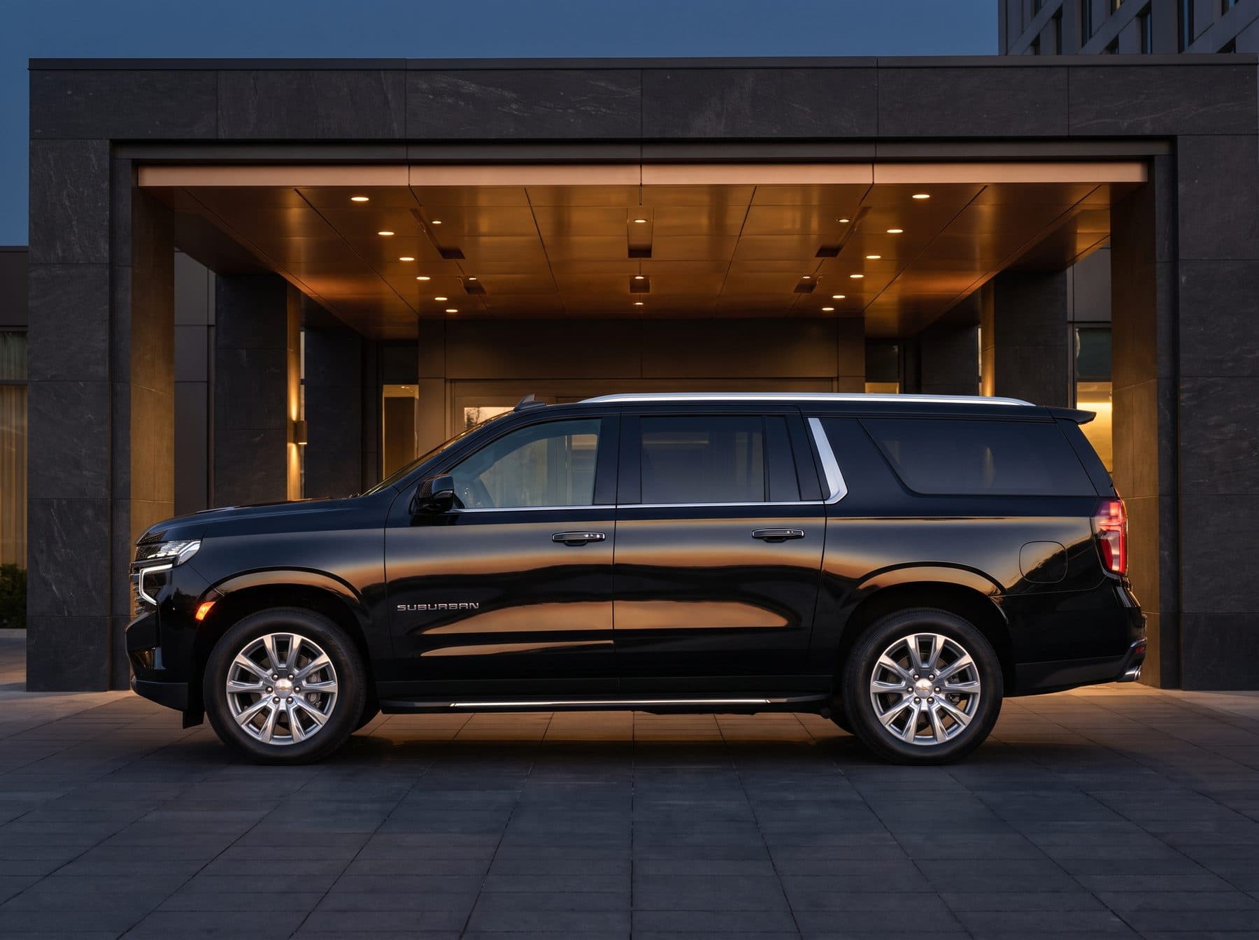 2022 Chevrolet Suburban executive SUV, black, side profile